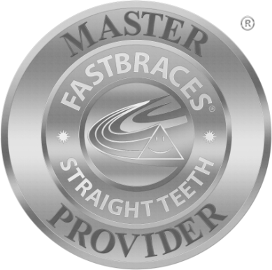 Silver round badge reading "Master Provider: Fastbraces, Straight Teeth" with a smiling triangular logo in the center.